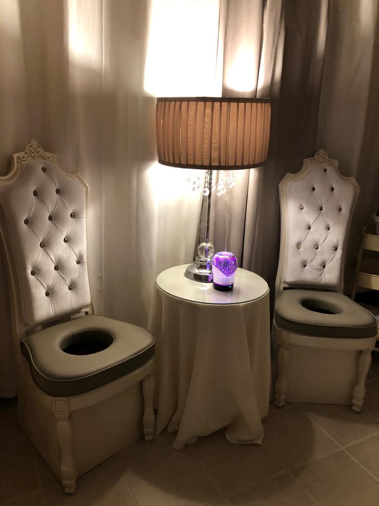 Designed chairs and a comfortable area are shown to perform vaginal steaming (v-steam)